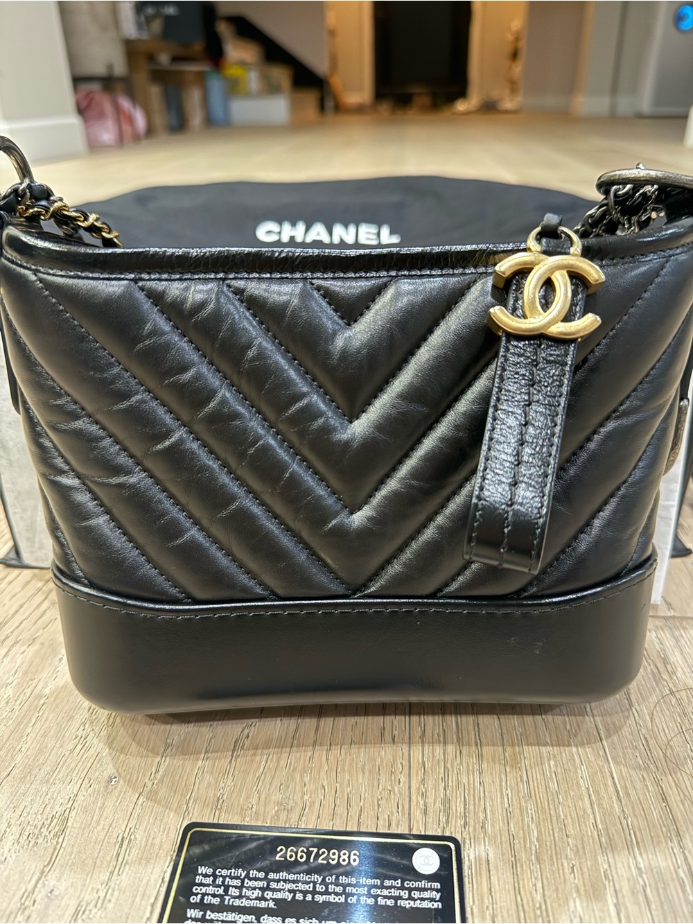 CHANEL Gabrielle Black Chevron Leather Crossbody with Gold Chain and CC Charm